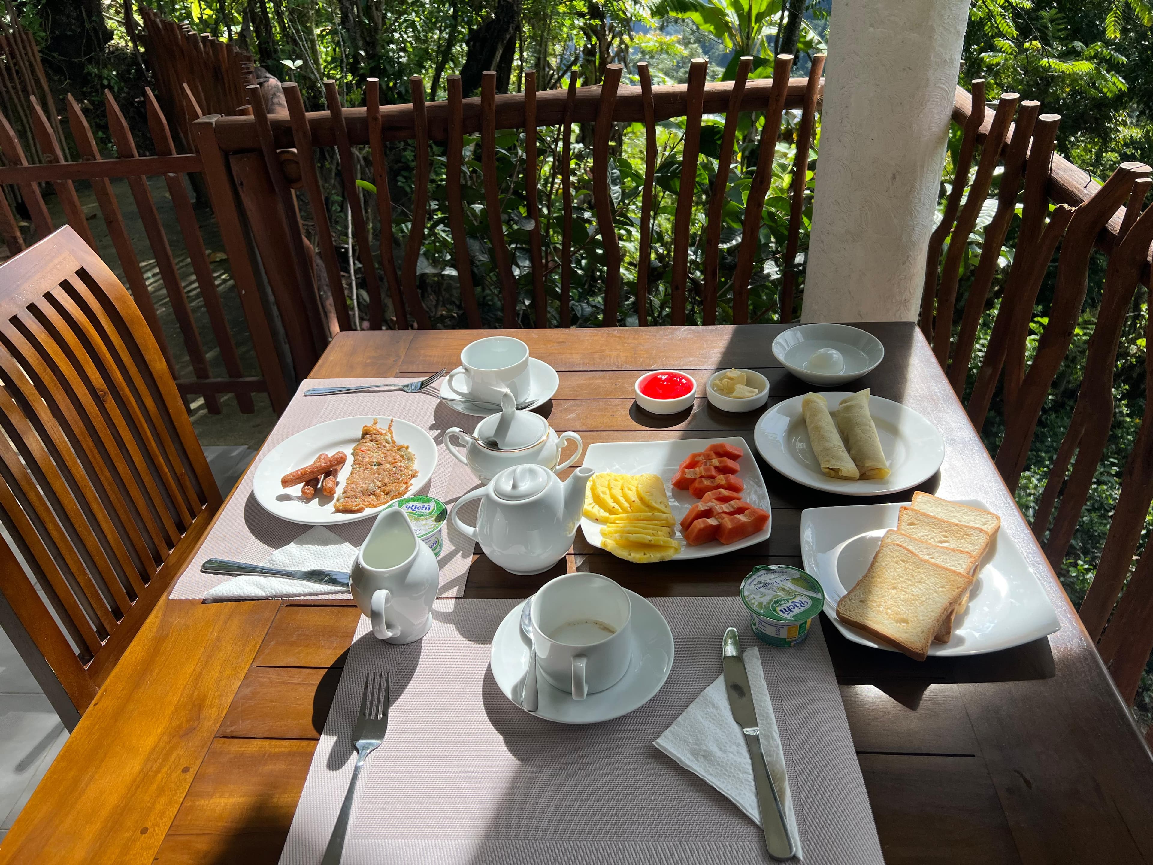 Breakfast table set on the balcony