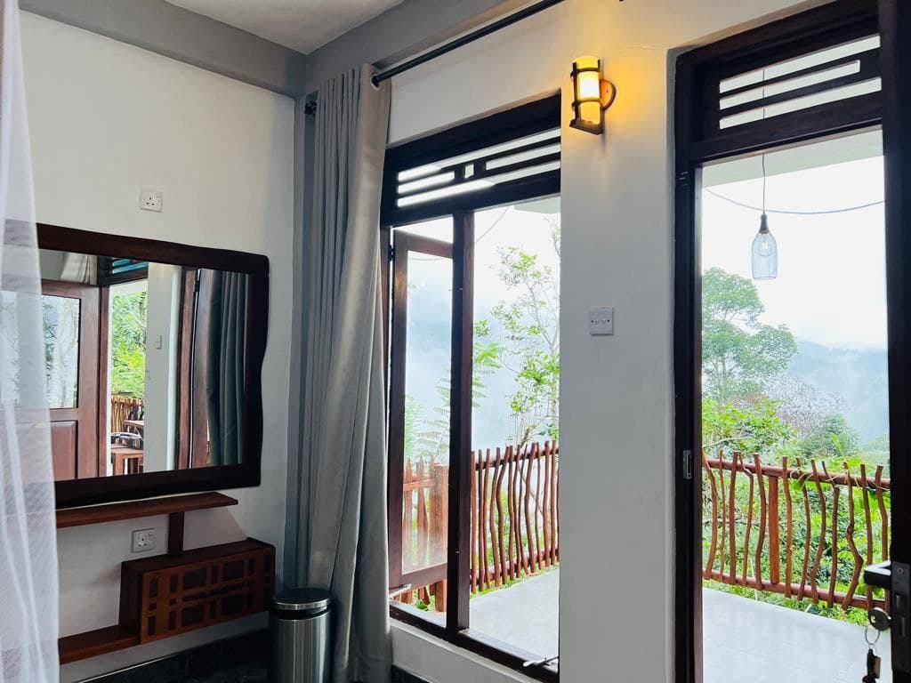 Hidden Cove windows and door opening onto the forest balcony