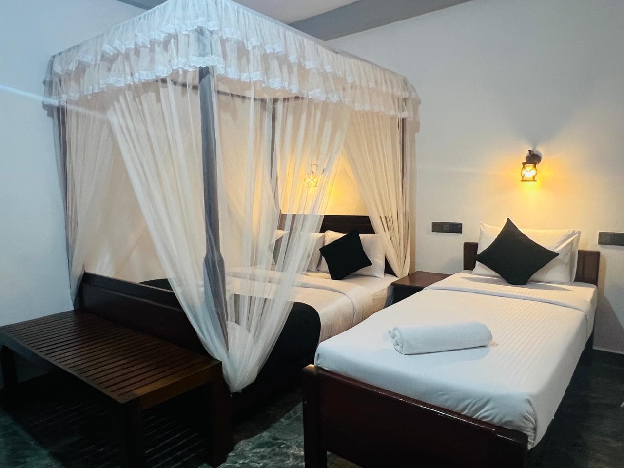 Canopy king and single beds in the Hidden Heaven room